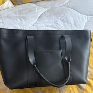 Chic Black Travel Tote by Monos- never used. Super cute / fits over carryon.
